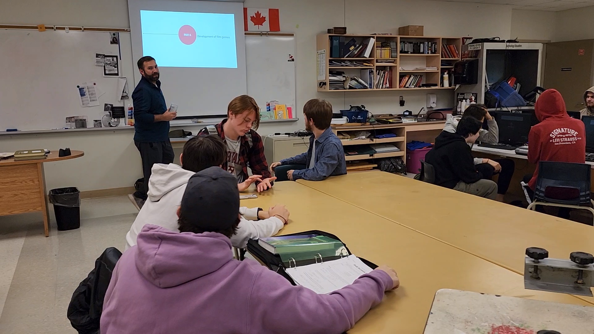 Film production class working together in a classroom
