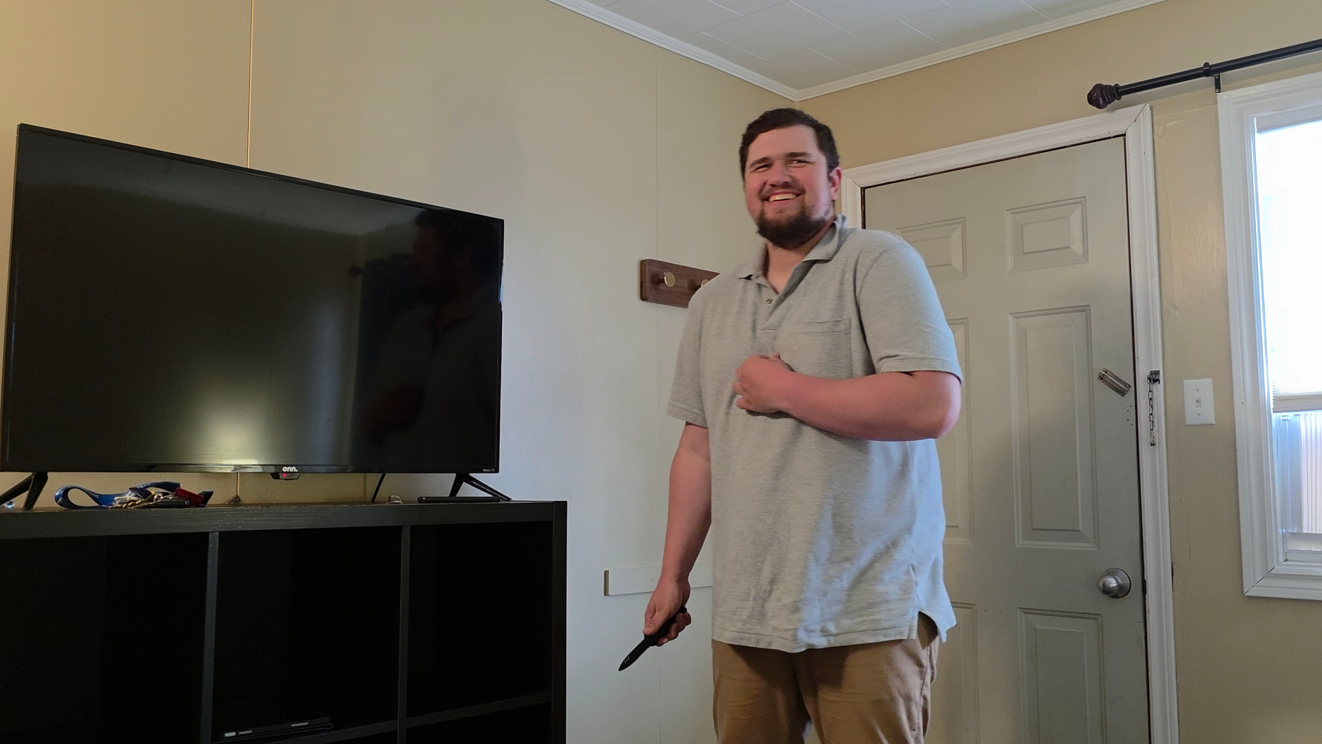Actor smiling between takes during a home interior scene
